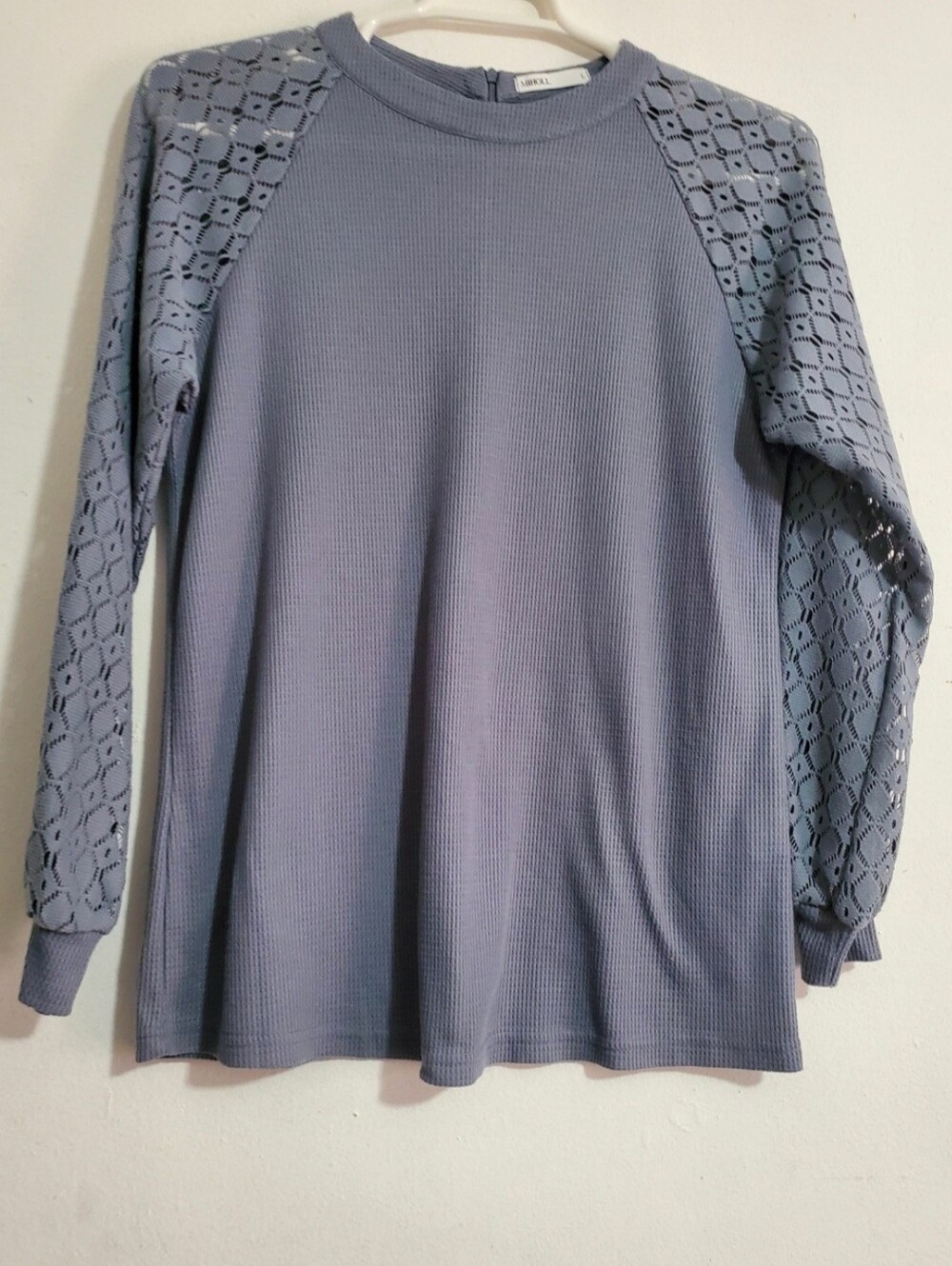 Gray Miholl long sleeve tunic top featuring lace detailing on the sleeves